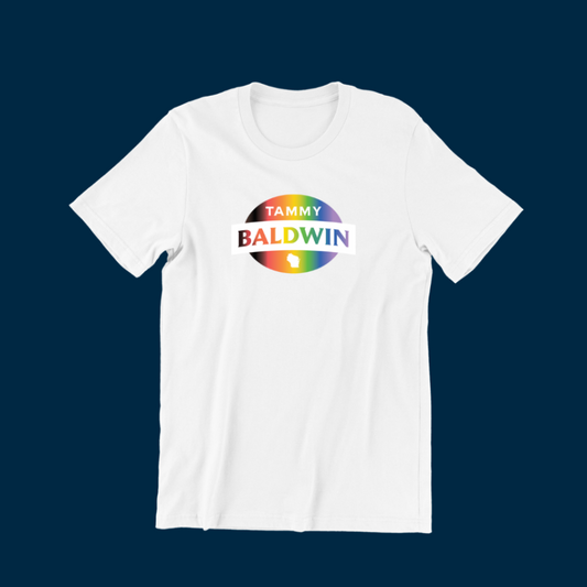 Unisex fit white t-shirt with a rainbow Tammy Baldwin for Senate logo at the center for Pride Month.